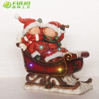 Indoor Christmas Decorations polyresin children on sleigh led lights Christmas ornaments